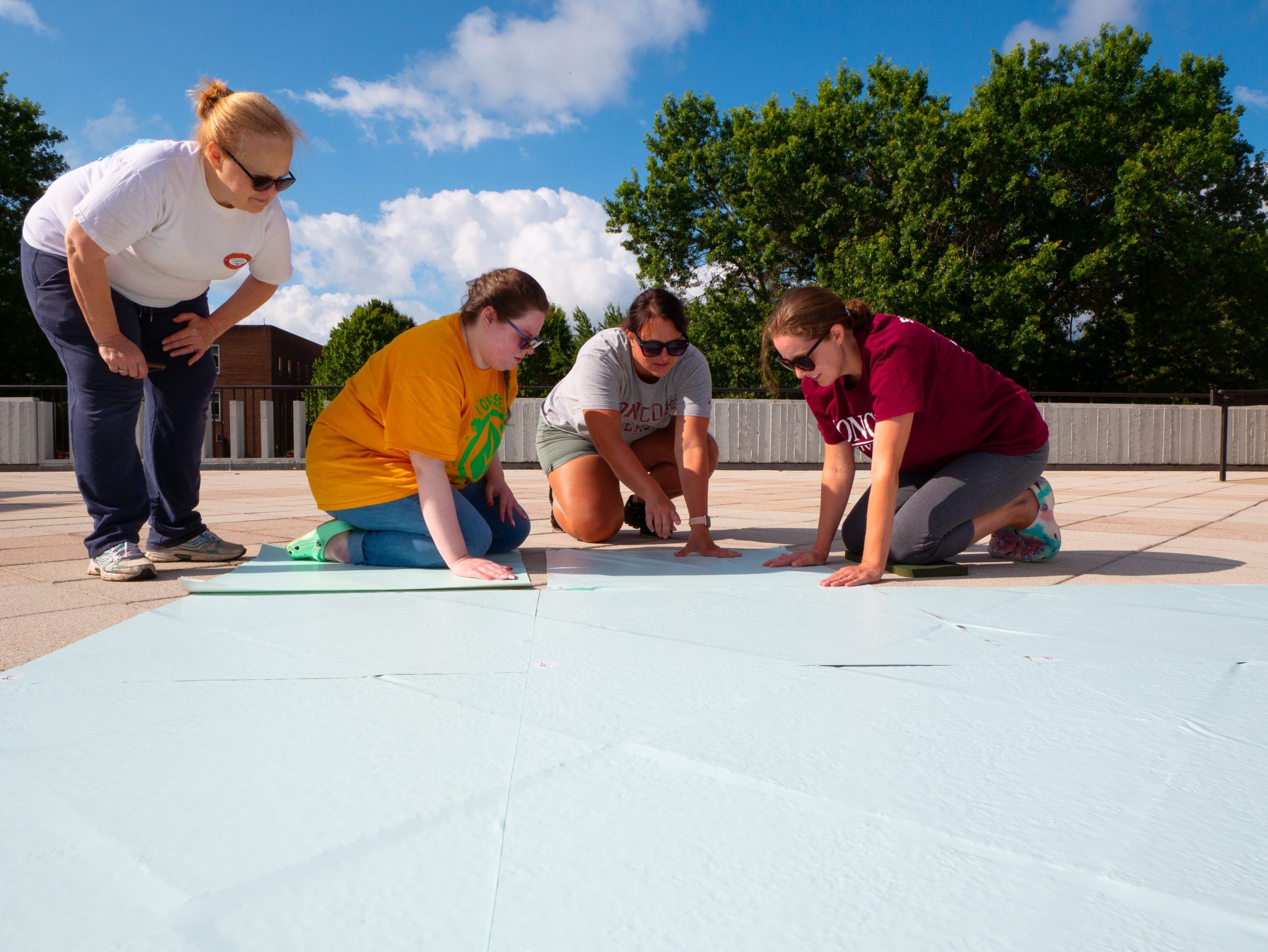 Concord University staff and students painting the labyrinth