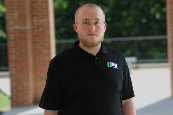 A photo of Austin Hale in front of University Point at Concord University