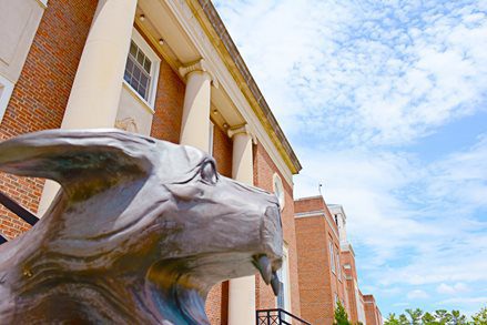 Photo of the Mountain Lion statue outside of the Concord University Library