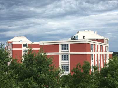 A photo of Towers Residence Halls at Concord University on a cloudy day