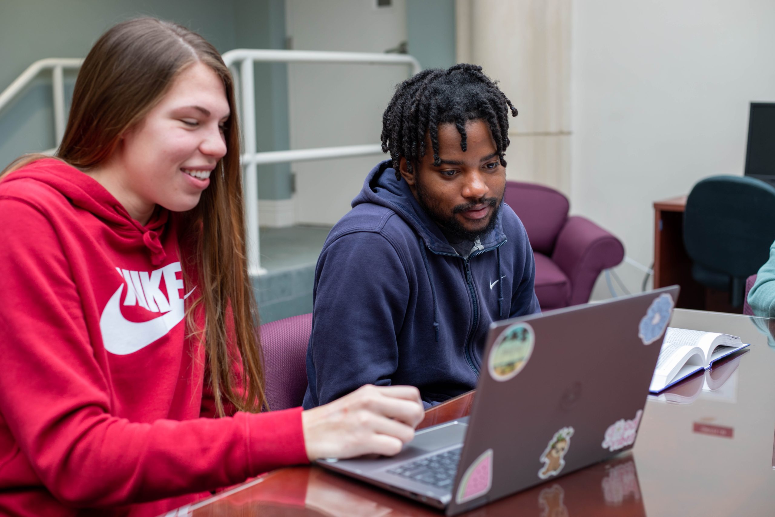 Two MBA students working on homework