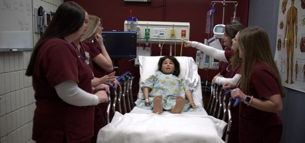 Nursing students during a demonstration in the SIM Lab