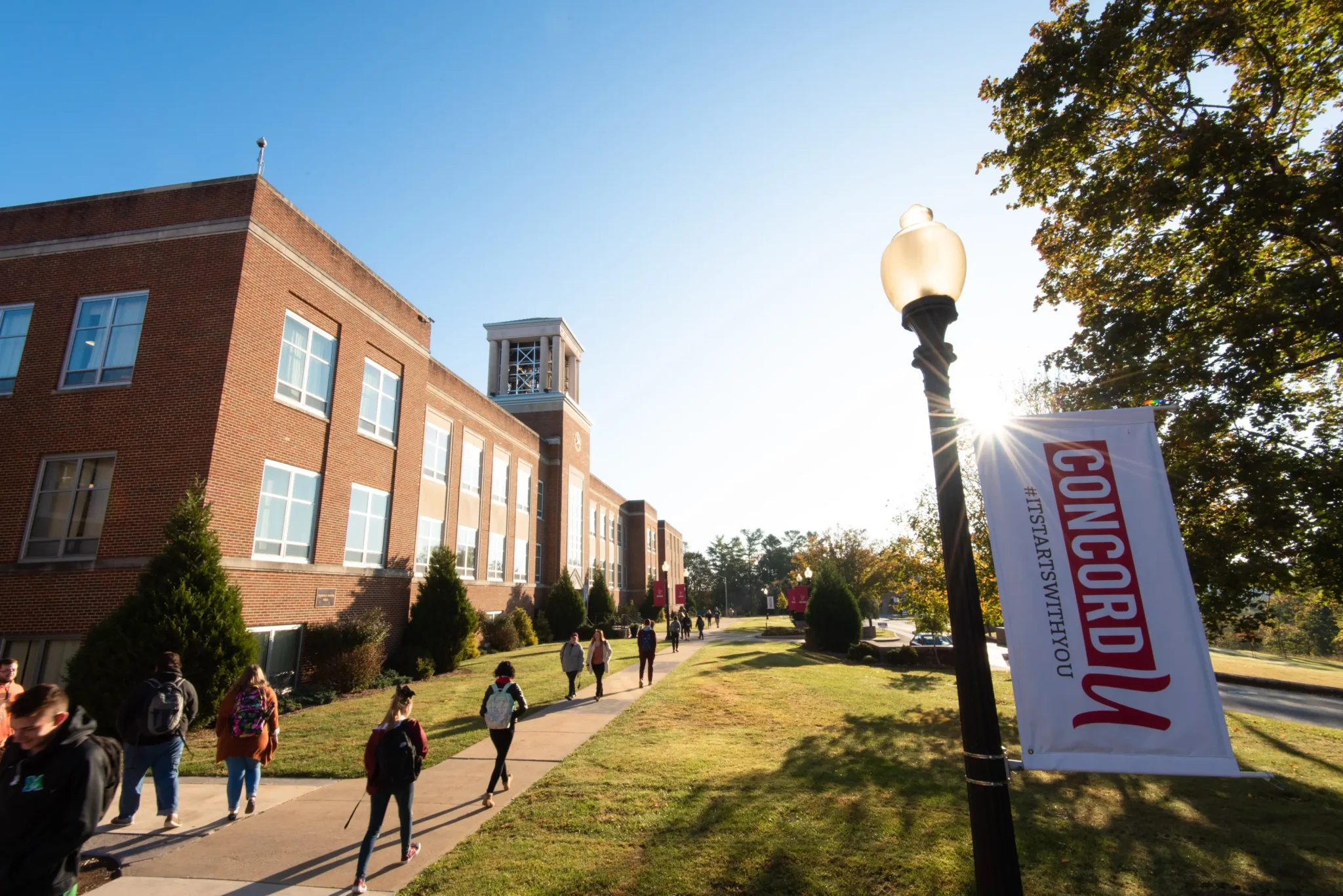 Students walking around Concord University's campus