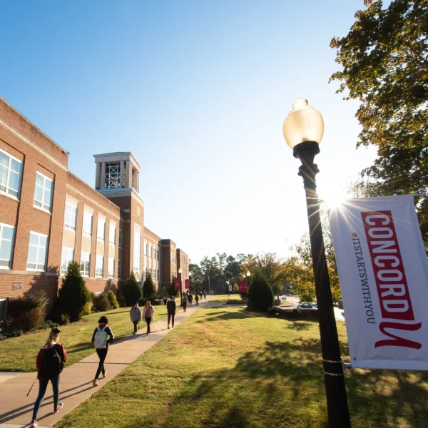 Students walking around Concord University's campus
