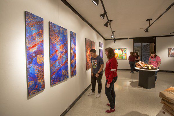 Students admiring the artwork in Concord's art gallery