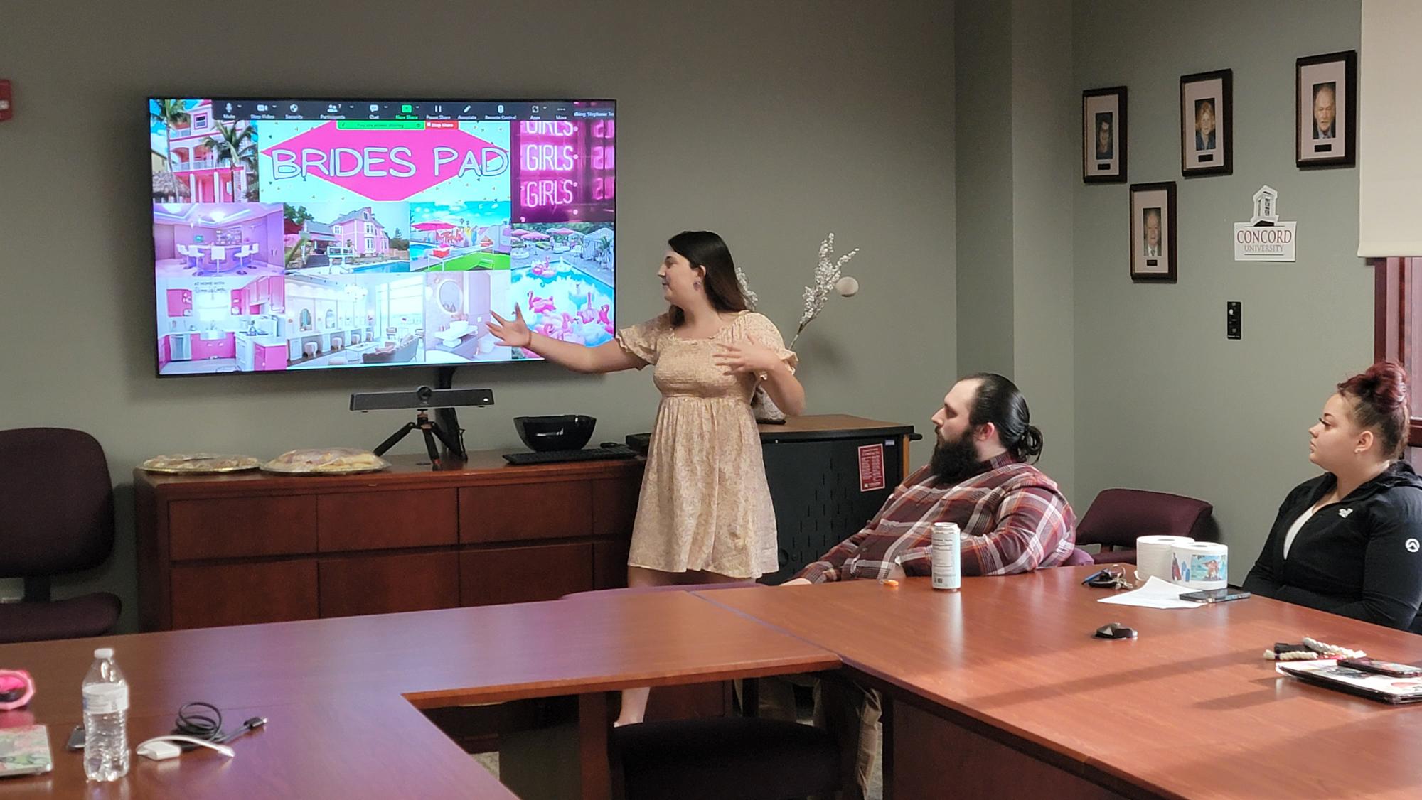 Student presenting a business plan to a panel of judges.