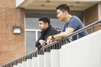 Two psychology students gathered at the Fine Arts Building on Concord's campus.