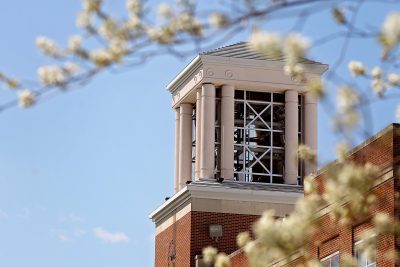 A photo of Concord University's bell tower with a clear blue sky in the background