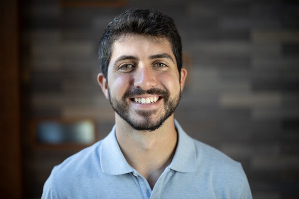 A photo of Adrian Cabello Espinar in front of a gray slate wall