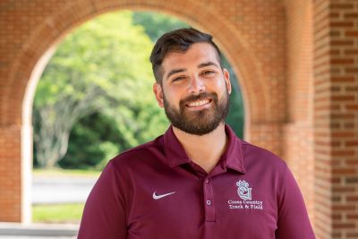 A photo of Andrew Barbera standing in front of University Point