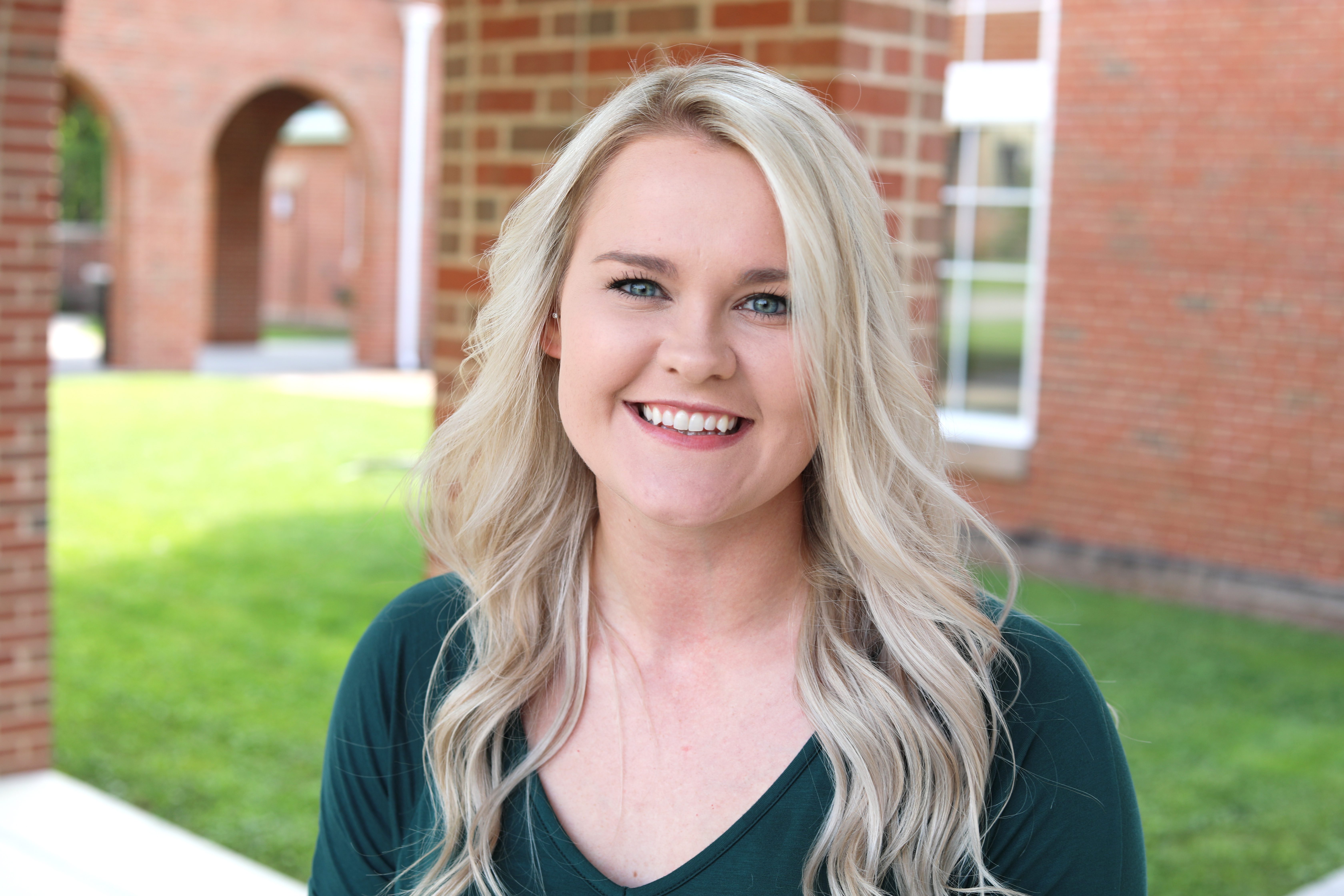 A photo of Dr. Samantha Byrd standing in front of University Point