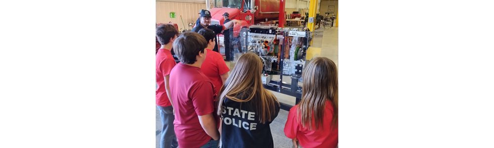 A group of Pikeview Middle School students learning about automobiles at New River Career and Technical Center