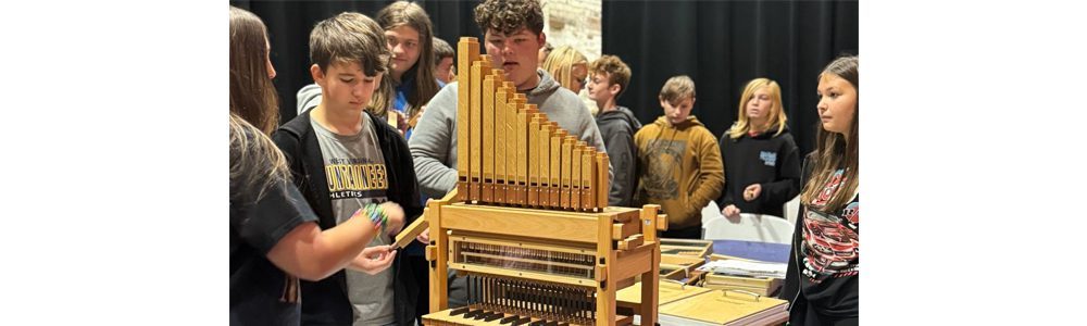 Students from Montcalm building a miniature pipe organ