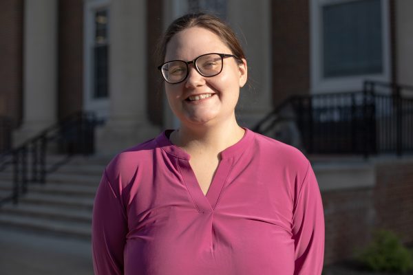 A photo of Heather Shepherd standing in front of the J. Franklin Marsh Library at Concord University