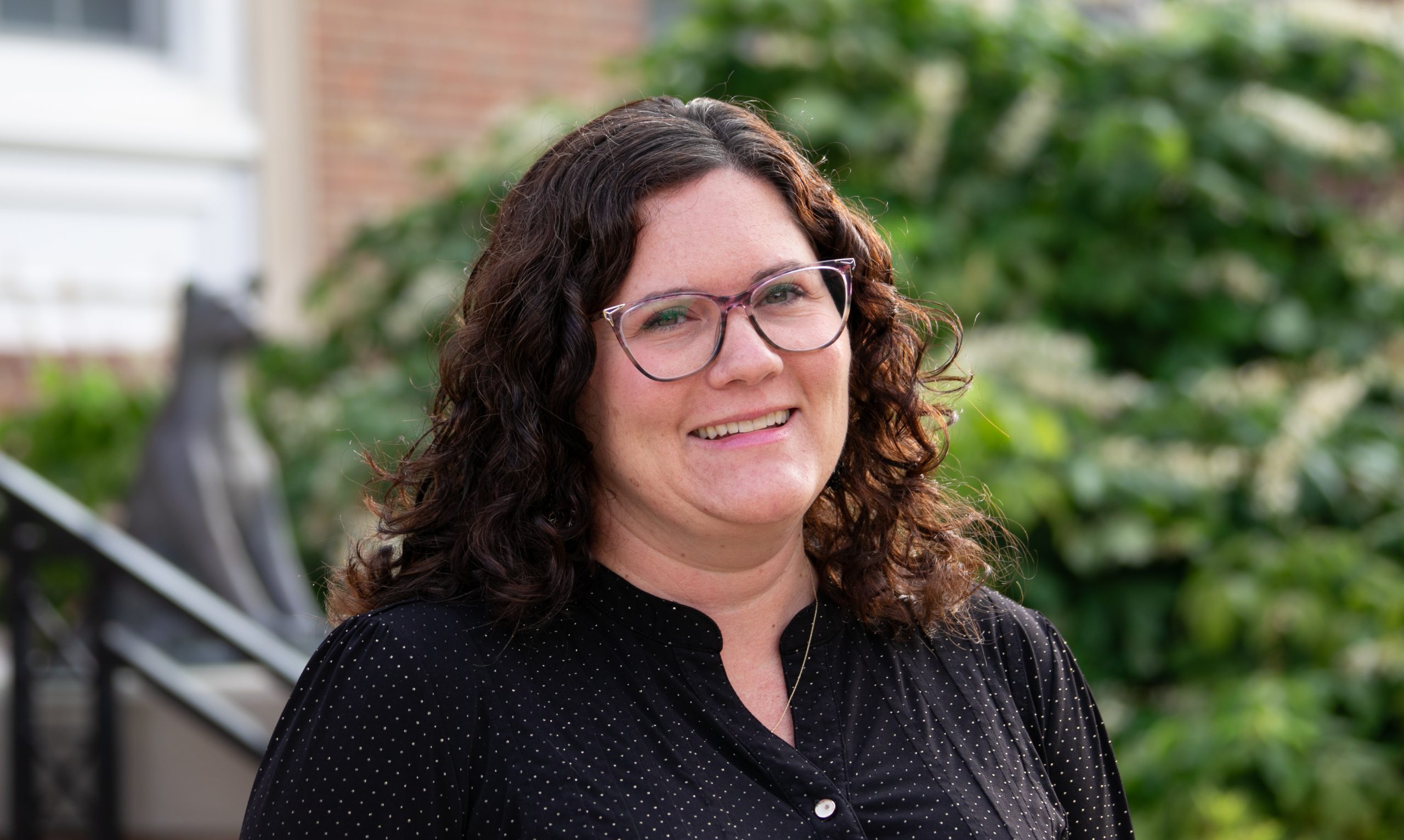 An image of Shannon Hilling in front of the CU Library.