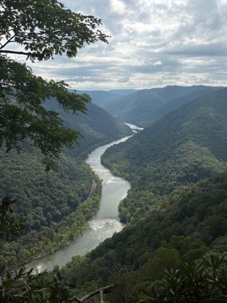 An aerial shot of a river and trees in WV