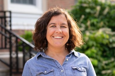 An image of Emily Landseidel in front of the CU Library.