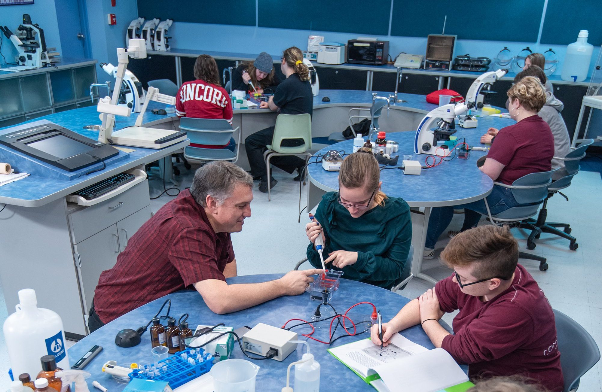 Dr. David Chambers conducting a biology lab with his students