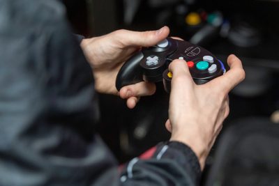 Esports player at Concord University holding controller.