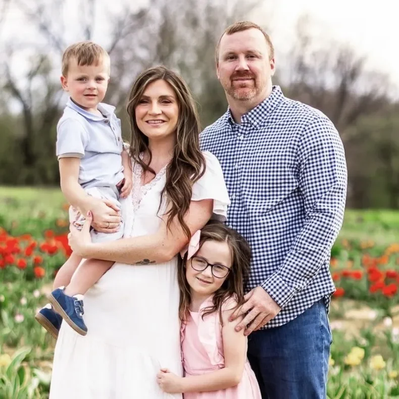 Veandala Bailey with her husband and kids in a tulip field