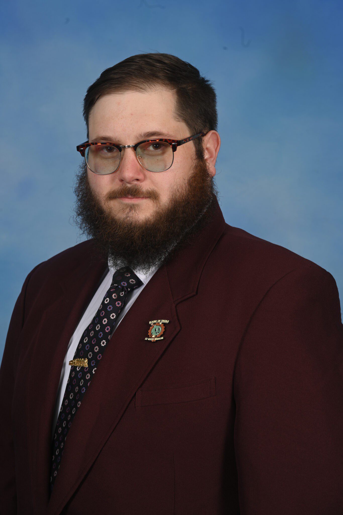 patrick erickson in front of a blue background